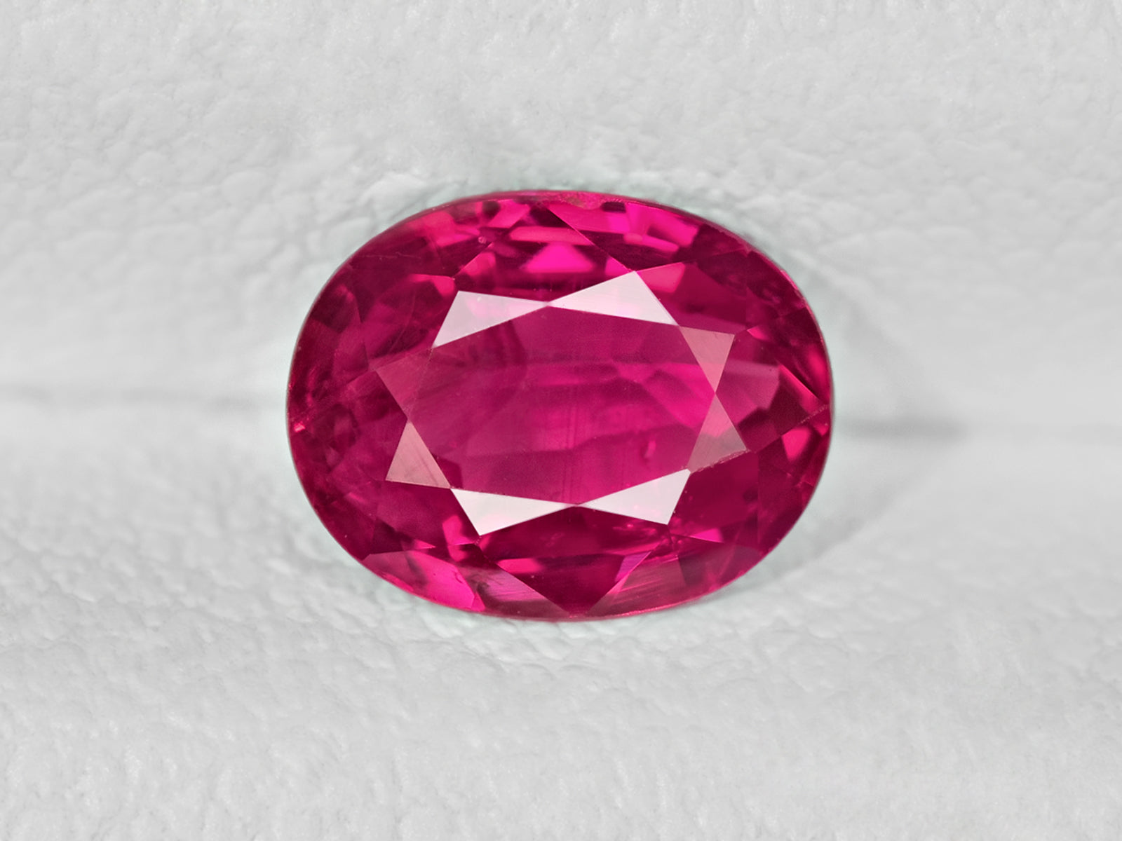 8802028-oval-lively-intense-pink-red-igi-mozambique-natural-ruby-1.01-ct