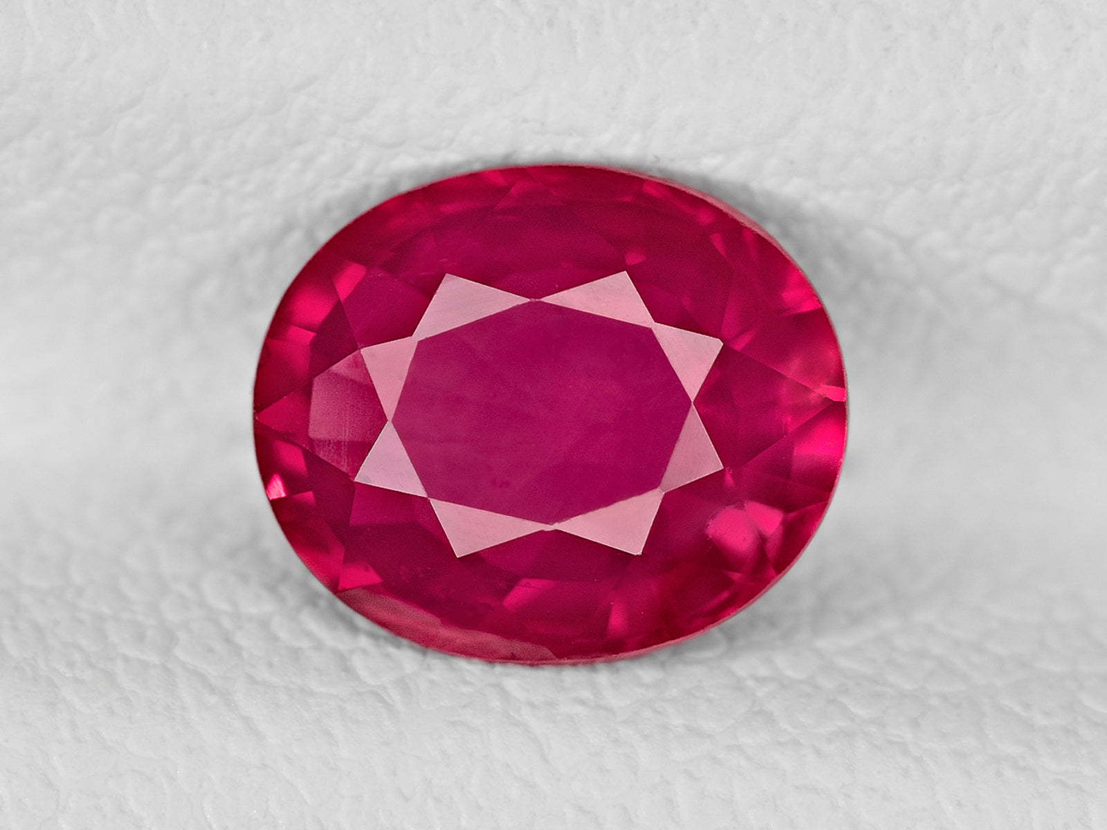 8802034-oval-velvety-deep-pinkish-red-igi-mozambique-natural-ruby-1.20-ct