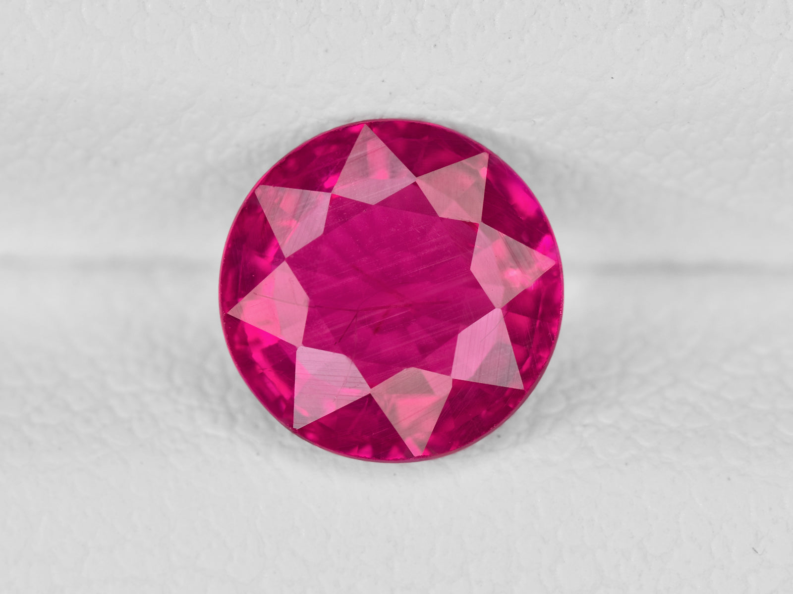 8802041-round-vivid-pink-red-igi-mozambique-natural-ruby-1.34-ct