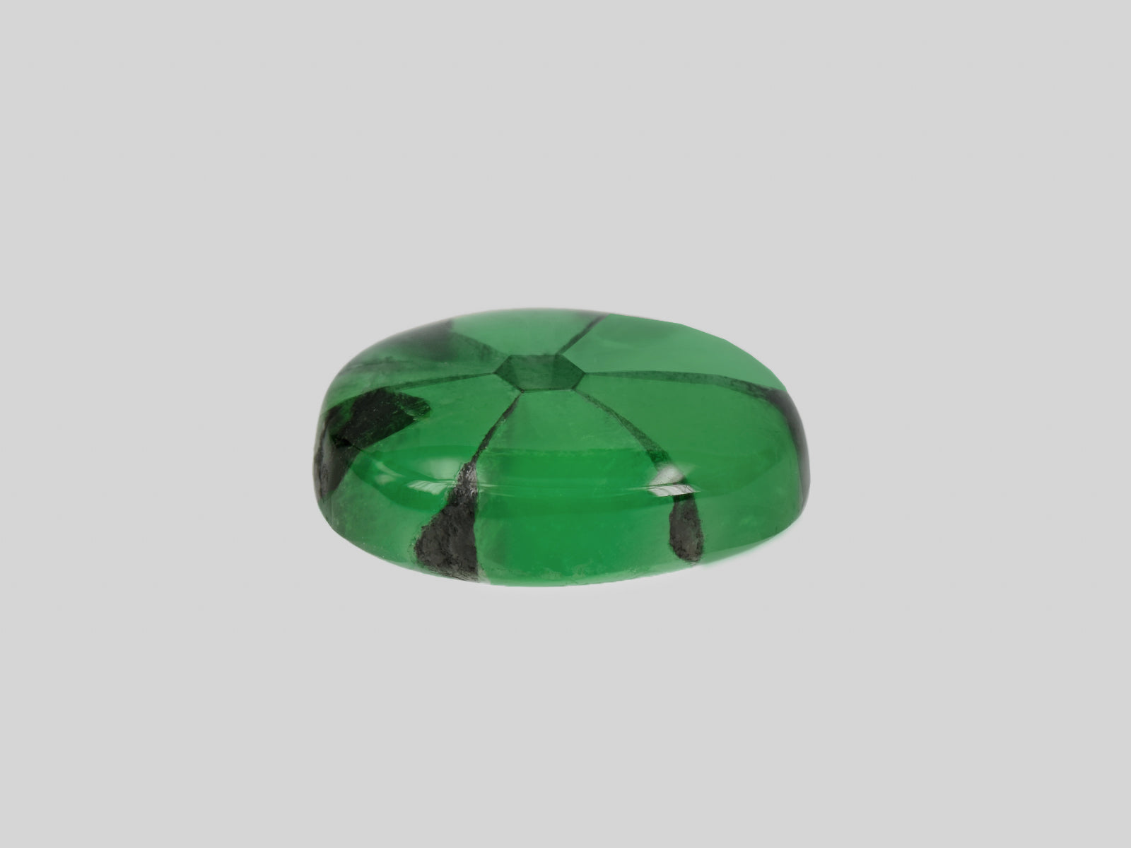 8802211-cabochon-deep-green-with-black-spokes-gia-colombia-natural-trapiche-emerald-7.09-ct