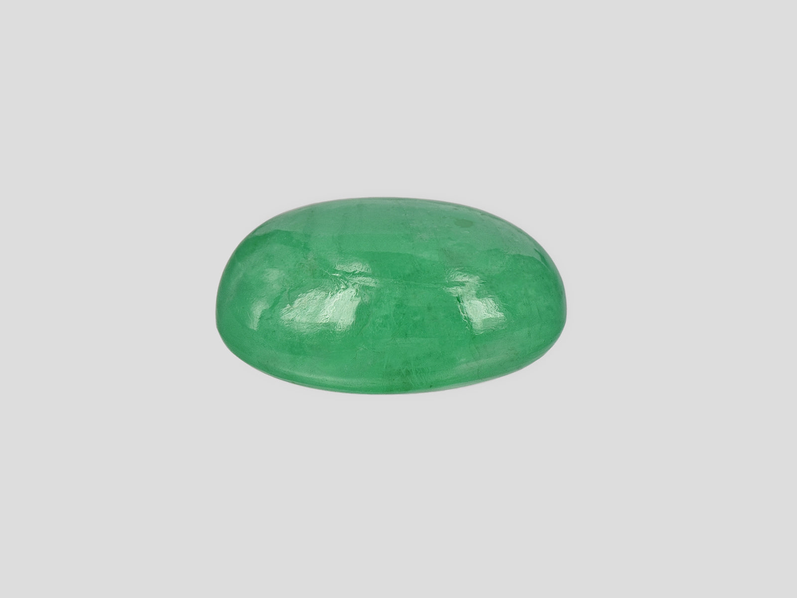 8802061-cabochon-lively-intense-green-russia-natural-emerald-12.70-ct