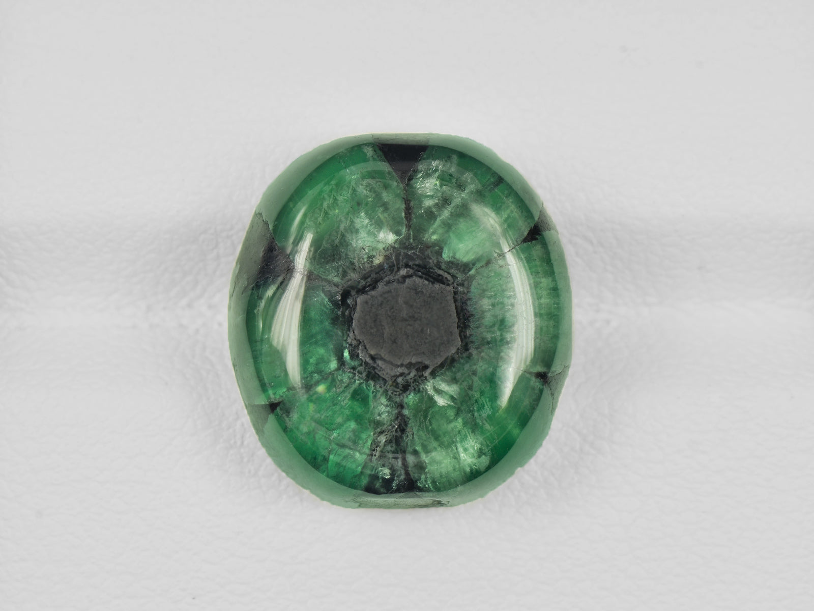8802128-cabochon-deep-green-with-black-spokes-igi-colombia-natural-trapiche-emerald-16.03-ct