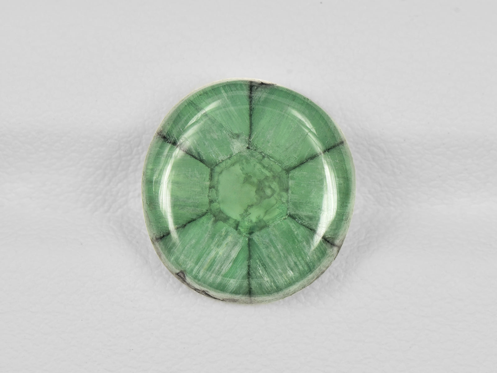 8802129-cabochon-soft-green-with-black-spokes-igi-colombia-natural-trapiche-emerald-7.55-ct