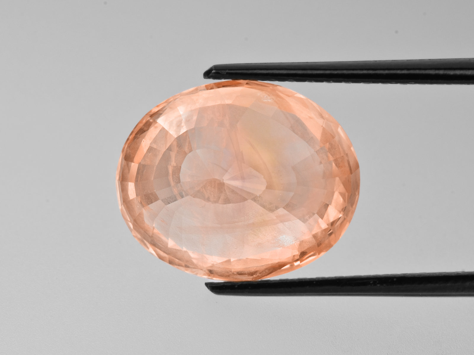 8802236-oval-sunset-orange-with-pinkish-hue-grs-sri-lanka-natural-padparadscha-13.05-ct