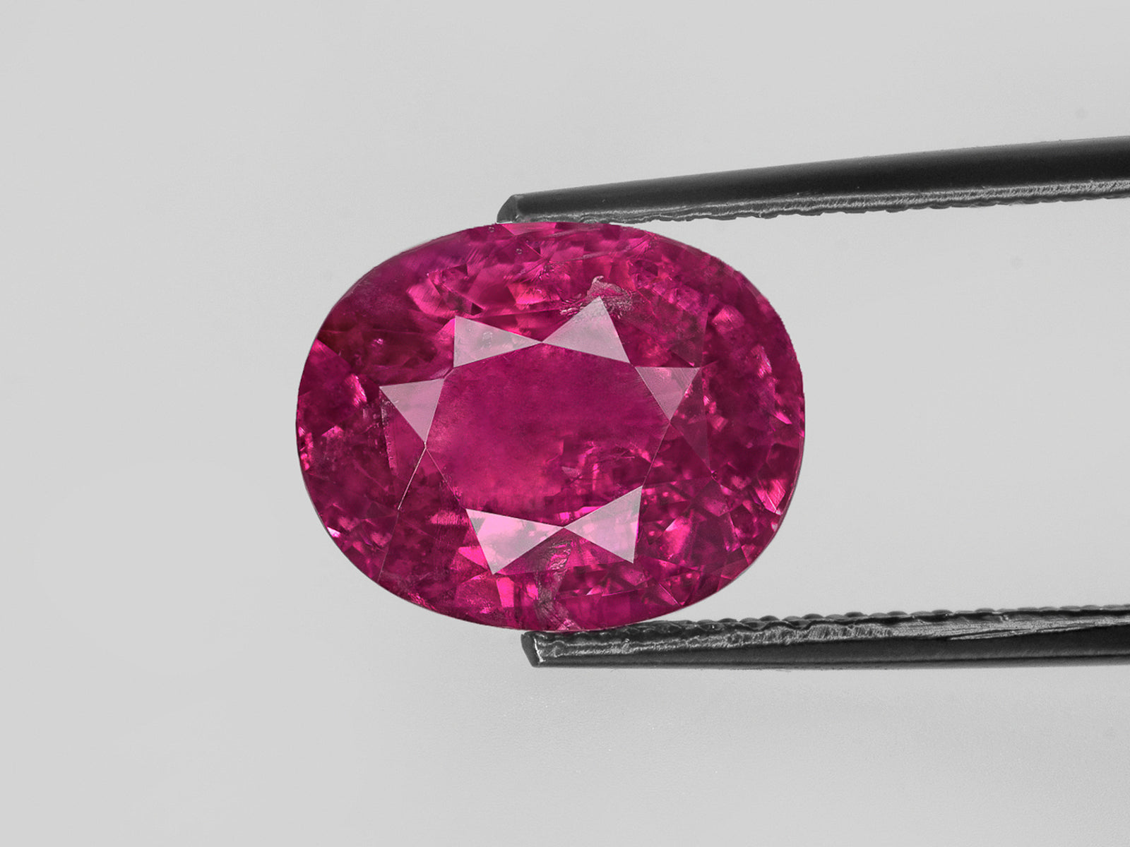 8802744-oval-fiery-vivid-purple-red-gia-afghanistan-natural-ruby-8.12-ct