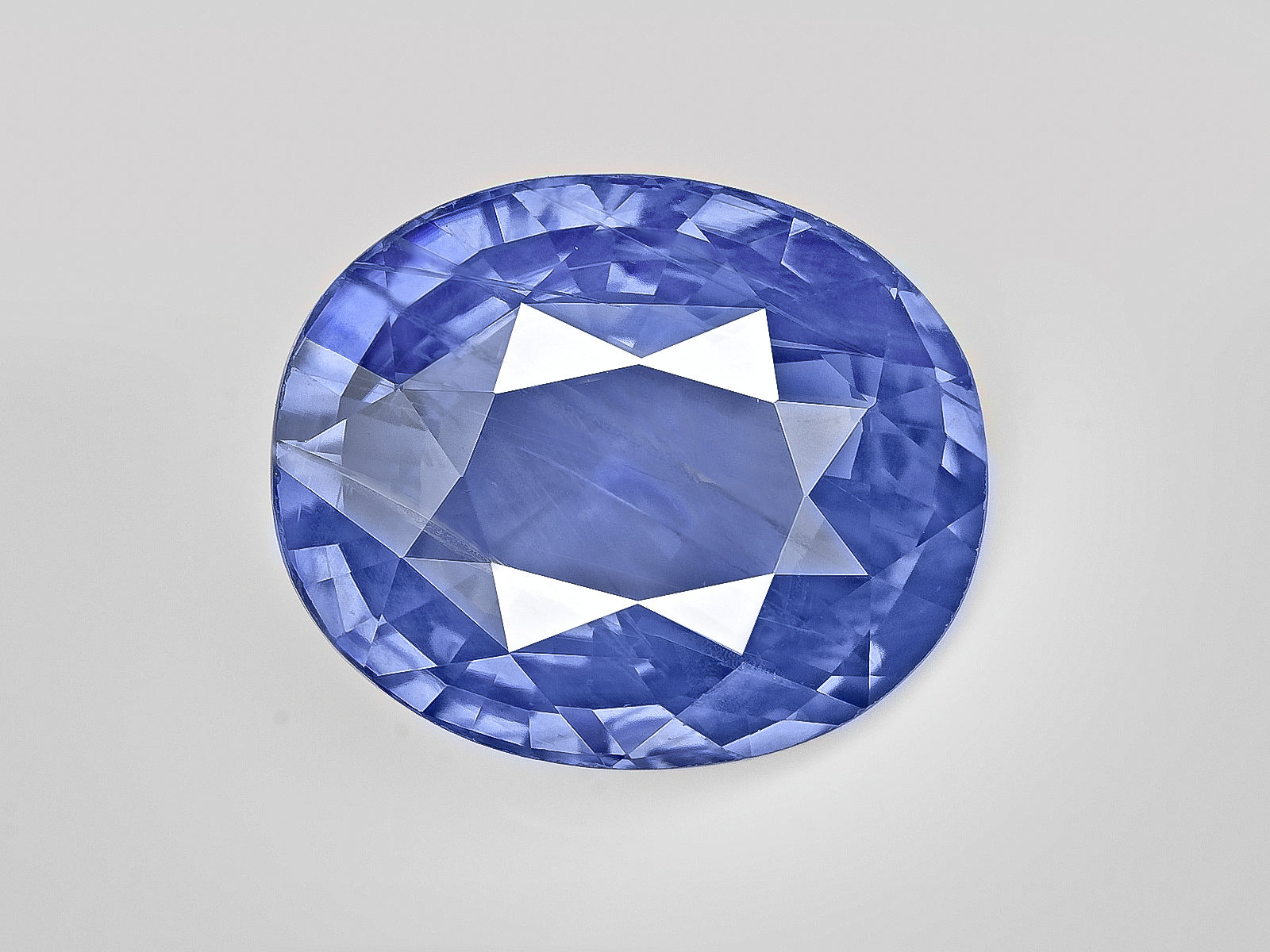 8802965-oval-velvety-intense-blue-sri-lanka-natural-blue-sapphire-10.55-ct