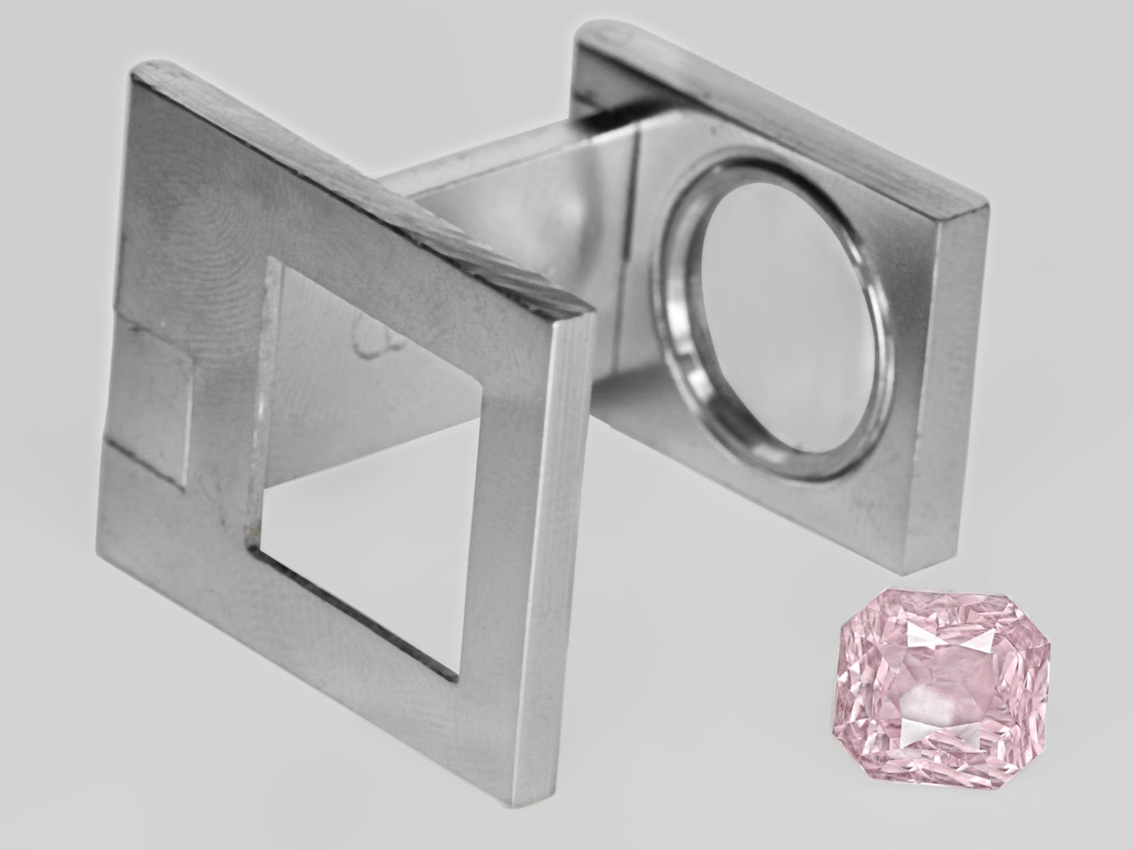 8803055-octagonal-lustrous-light-pink-with-orangish-hue-aigs-madagascar-natural-padparadscha-4.91-ct