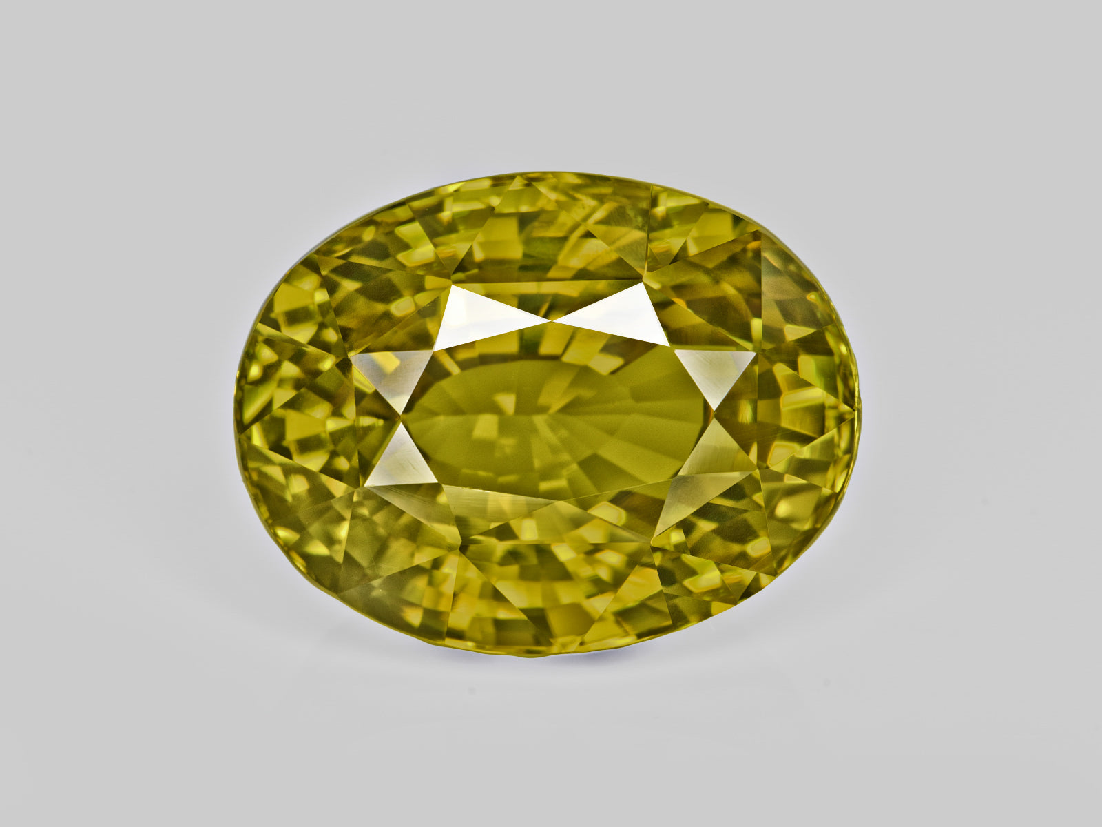 8803077-oval-fiery-vivid-yellowish-green-changing-to-brownish-yellow-gia-madagascar-natural-alexandrite-21.85-ct