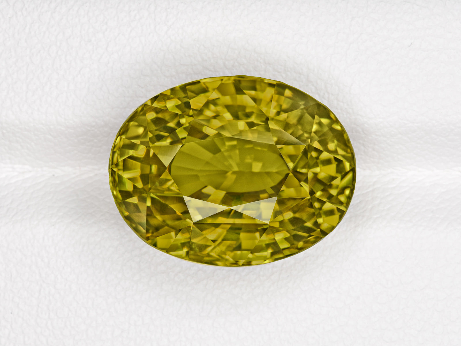 8803077-oval-fiery-vivid-yellowish-green-changing-to-brownish-yellow-gia-madagascar-natural-alexandrite-21.85-ct