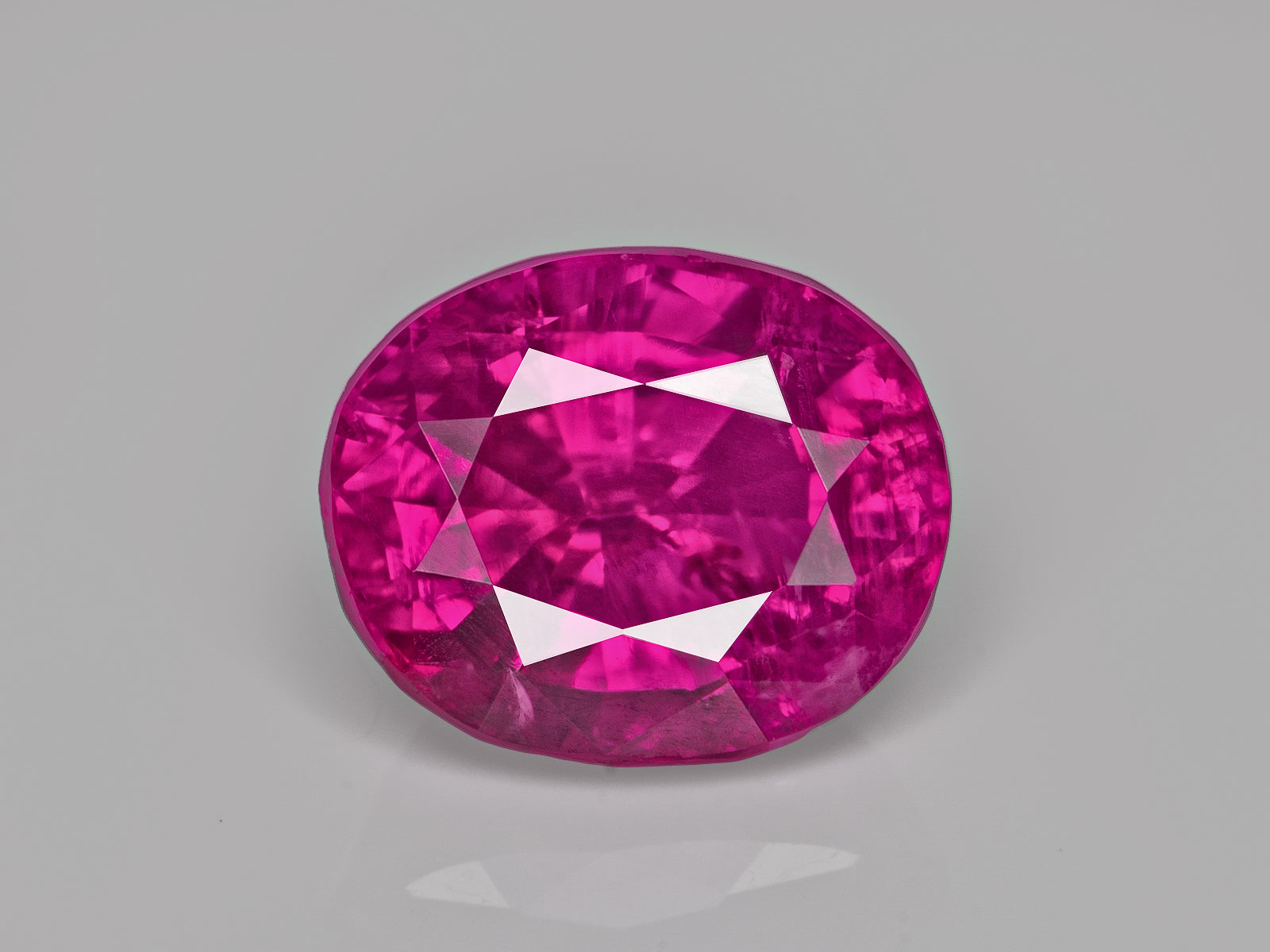 8803099-oval-rich-vivid-pinkish-red-lotus-afghanistan-natural-ruby-1.10-ct
