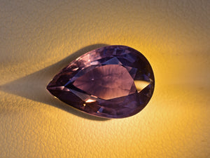 8801741-pear-greyish-violet-changing-to-deep-violet-aigs-tanzania-natural-color-change-sapphire-7.20-ct