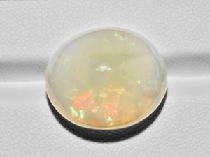 8801106-cabochon-yellowish-white-with-multi-color-flashes-gii-ethiopia-natural-white-opal-19.77-ct