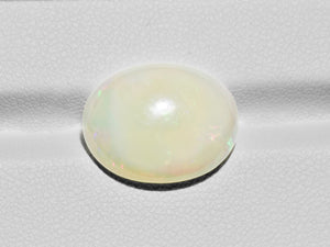 8801103-cabochon-light-yellow-with-multi-color-flashes-igi-ethiopia-natural-white-opal-7.02-ct
