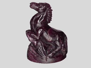 8801460-carved-dark-purple-red-gii-liberia-natural-ruby-63.28-ct