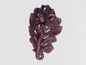 8801544-carved-dark-purple-red-gii-liberia-natural-ruby-28.30-ct