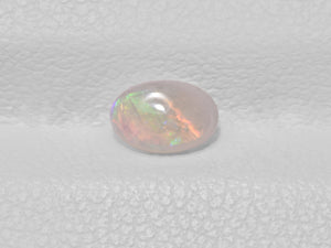 8801428-cabochon-very-light-brown-with-multi-color-flashes-igi-australia-natural-white-opal-0.28-ct