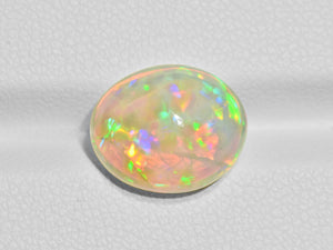 8801573-cabochon-brownish-yellow-with-multi-color-flashes-igi-ethiopia-natural-white-opal-5.14-ct